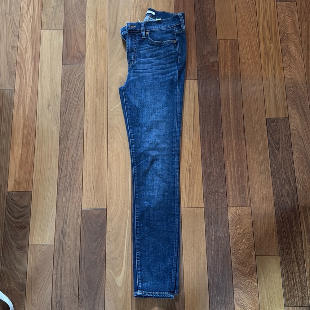 Medium/dark wash skinny jeans, J Crew brand, unsure of exact size (about a 4/6)